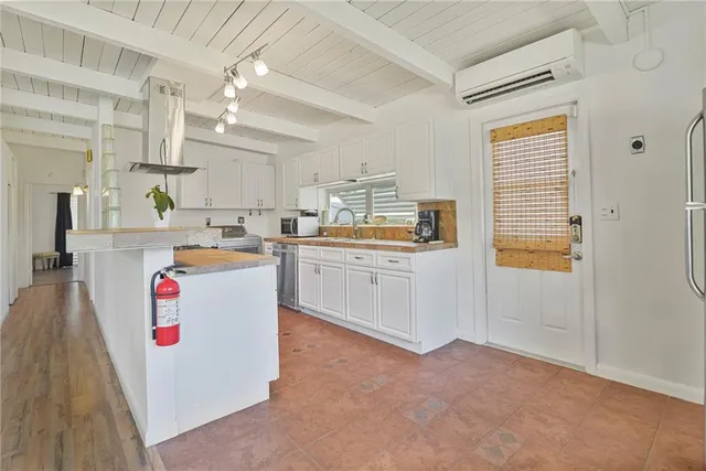 a kitchen with cabinets and window