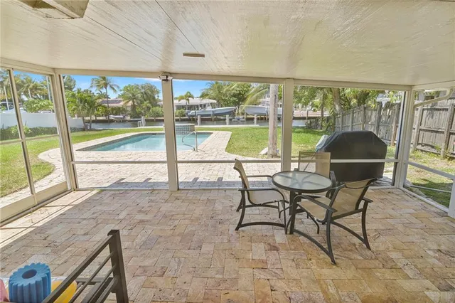 a view of a living room and a floor to ceiling window