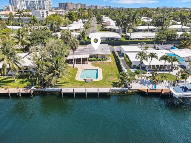 a view of outdoor space with swimming pool and lake view