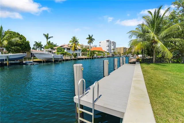 a view of a lake with a table and chairs