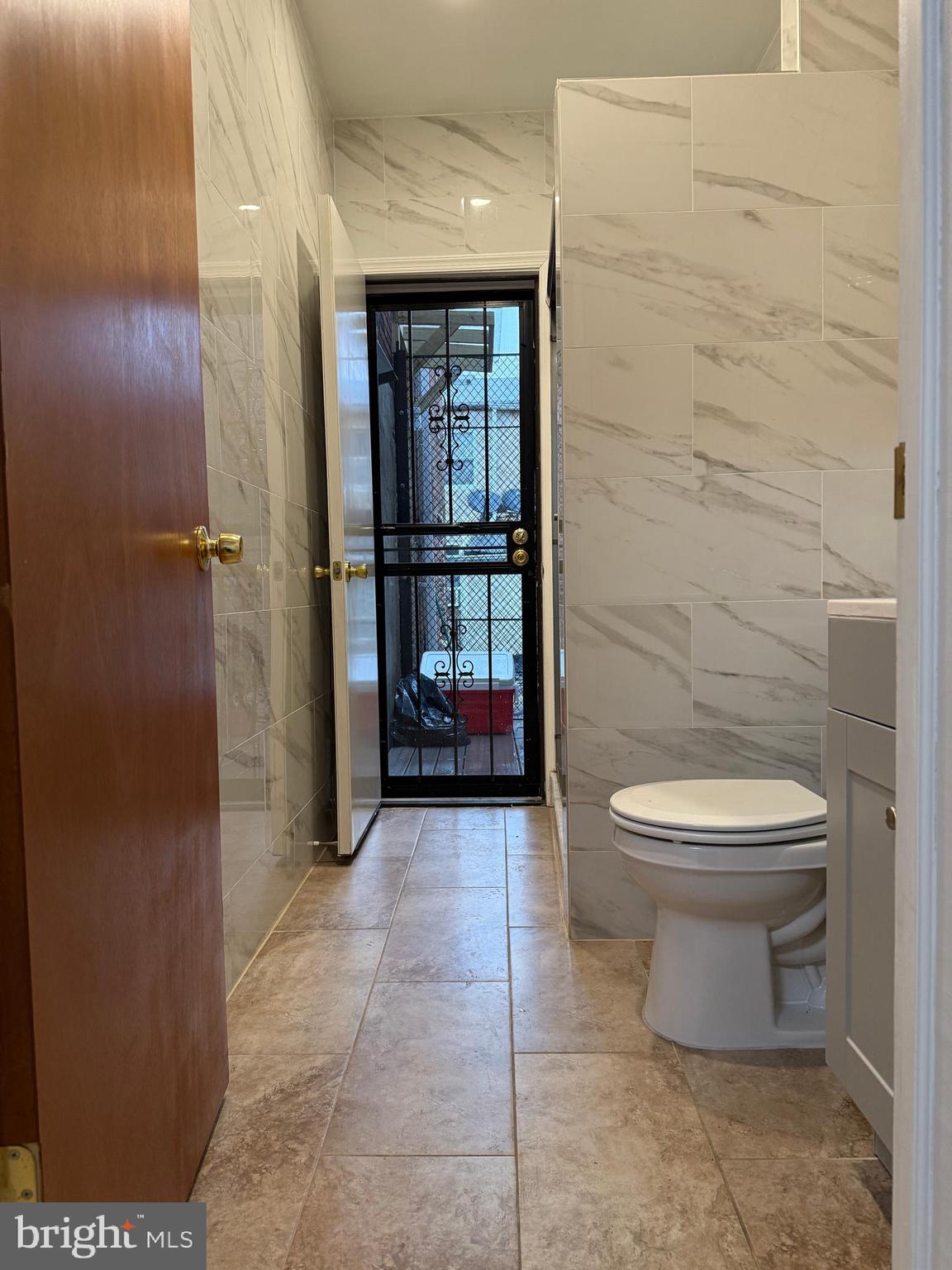 1017 Spring Garden Street, Unit 2F Philadelphia, PA 19123 - Photo 11 of 14 a bathroom with a toilet and a shower