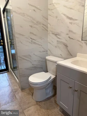 a toilet sitting next to a bathroom sink