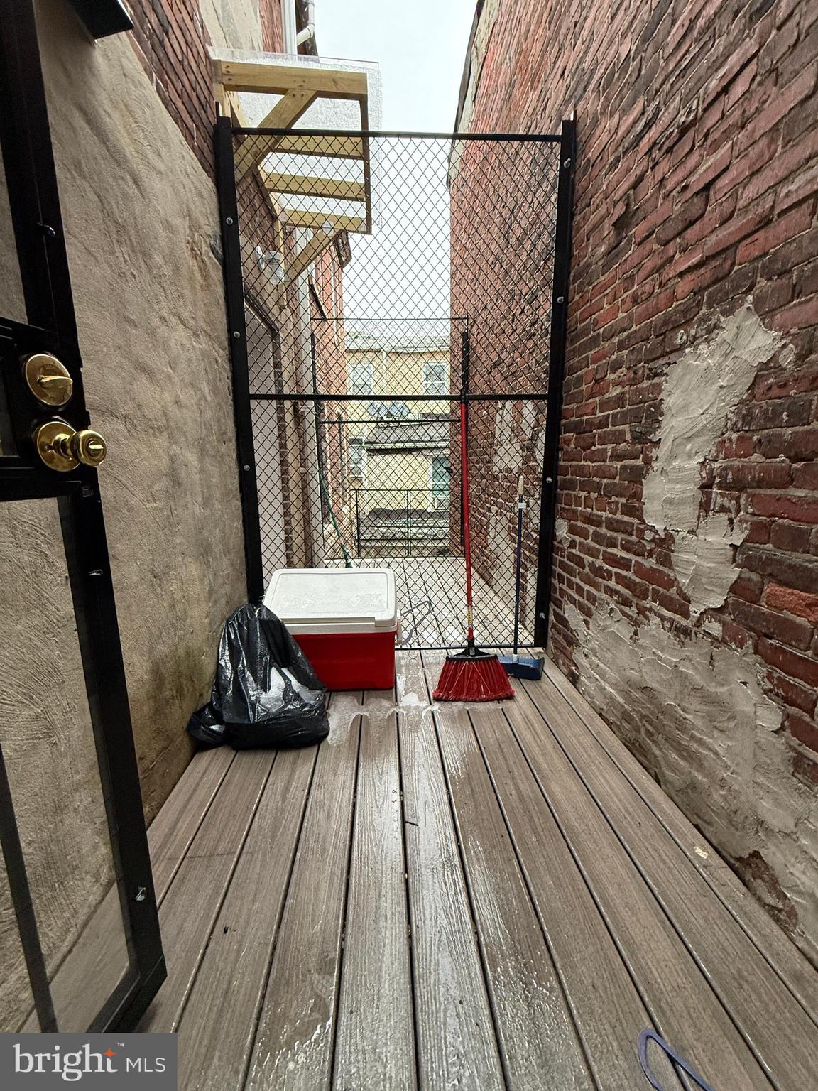 1017 Spring Garden Street, Unit 2F Philadelphia, PA 19123 - Photo 14 of 14 a view of balcony with wooden floor and outdoor seating