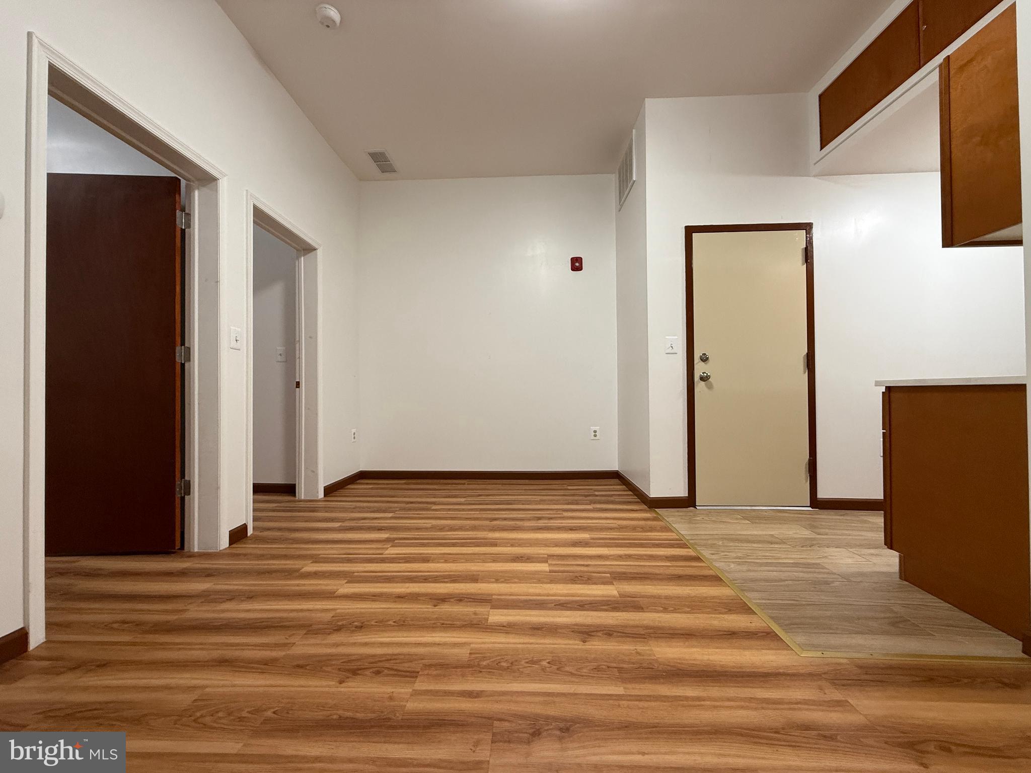 1017 Spring Garden Street, Unit 2F Philadelphia, PA 19123 - Photo 2 of 14 a view of a livingroom with wooden floor and closet