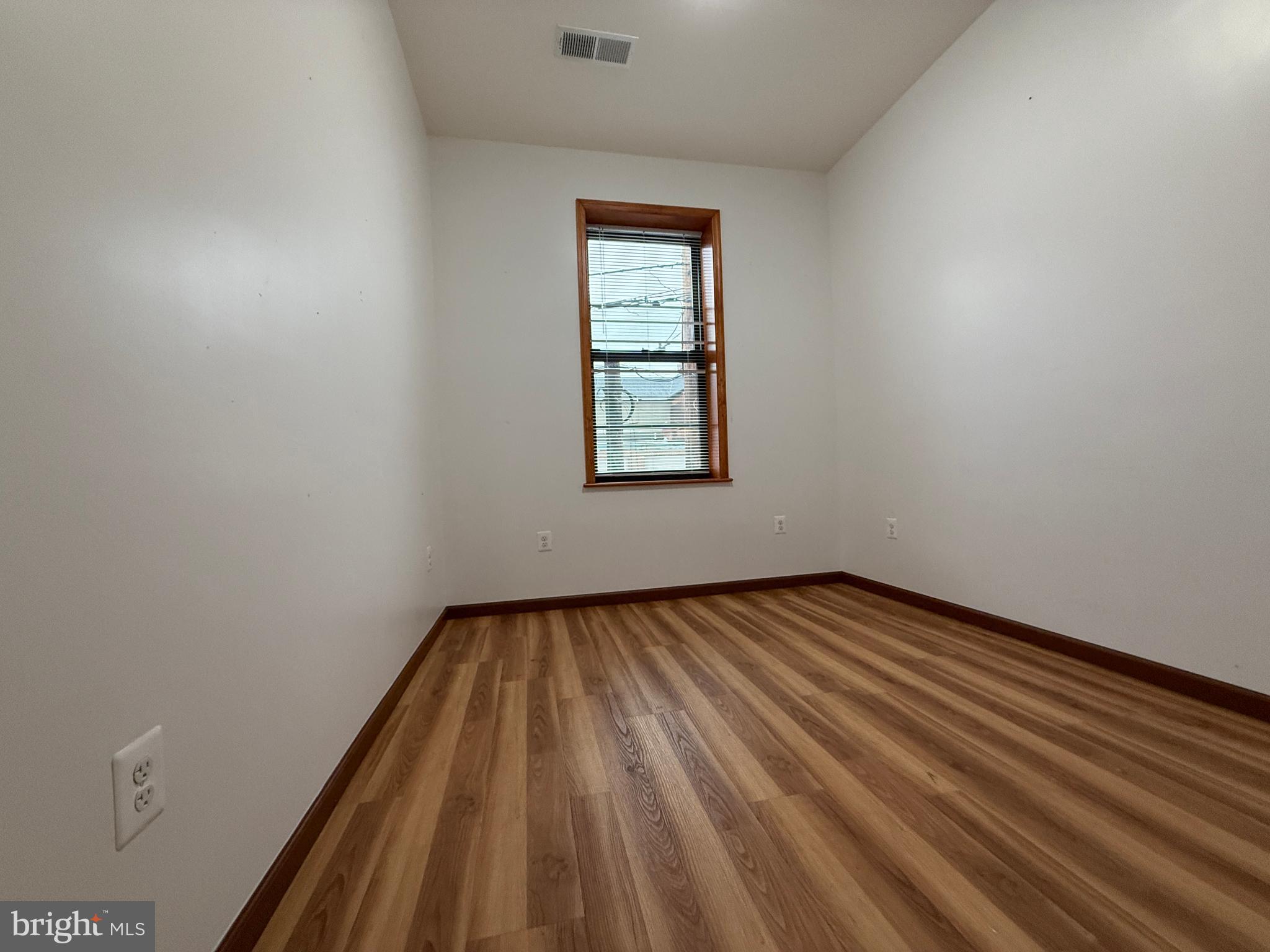 1017 Spring Garden Street, Unit 2F Philadelphia, PA 19123 - Photo 6 of 14 a view of an empty room and window