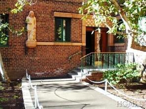 1520 Archer Road, Unit 5H Bronx, NY 10462 - Photo 1 of 1 a backyard of a house with outdoor seating