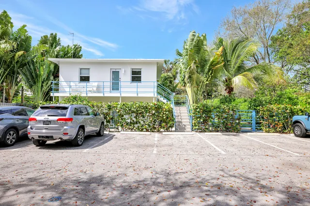 a view of car parked in front of a house