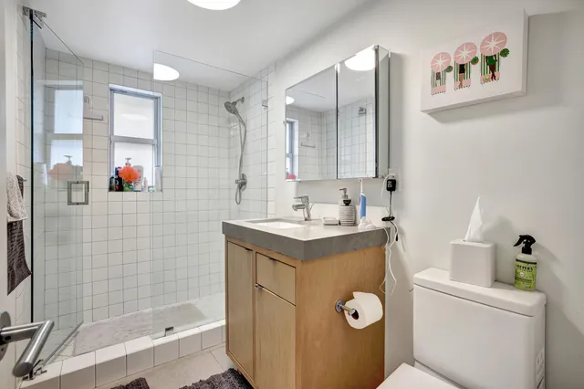 a living room with furniture flowerpot and a chandelier