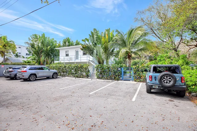 a view of a car parked in front of a house