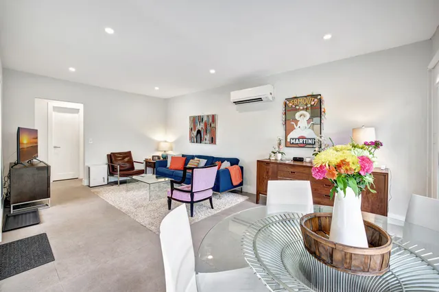 a view of a swimming pool in he middle of the green field