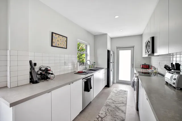 a view of a chairs and table in the patio