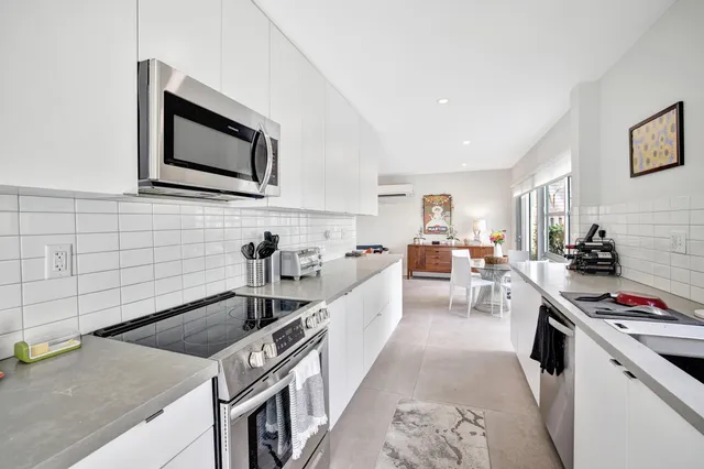 a view of a chair and tables in the backyard