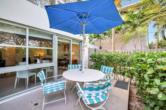 a kitchen with a sink and refrigerator