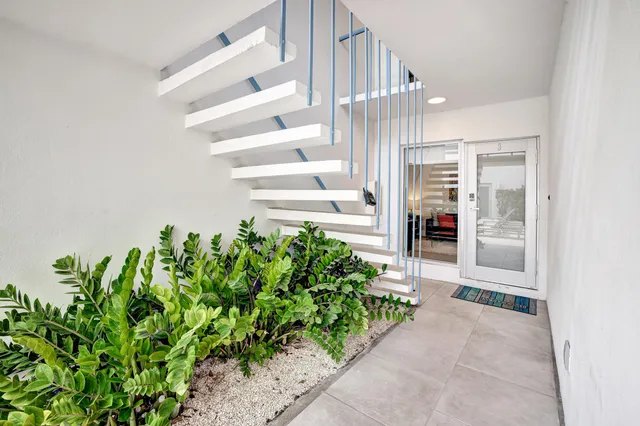 a bedroom with two beds and a dresser