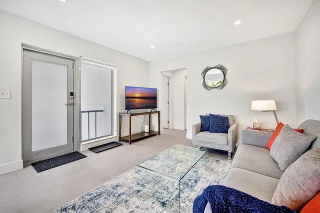 a bedroom with a bed and chair