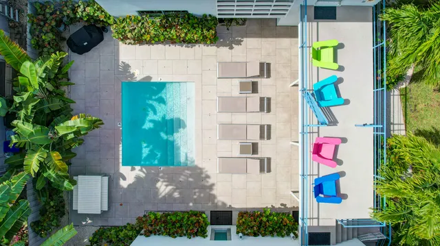 an aerial view of a house with outdoor space