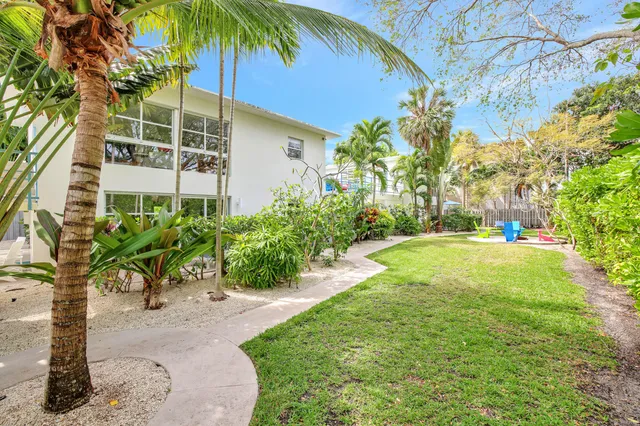 a living room with fireplace furniture and a flat screen tv