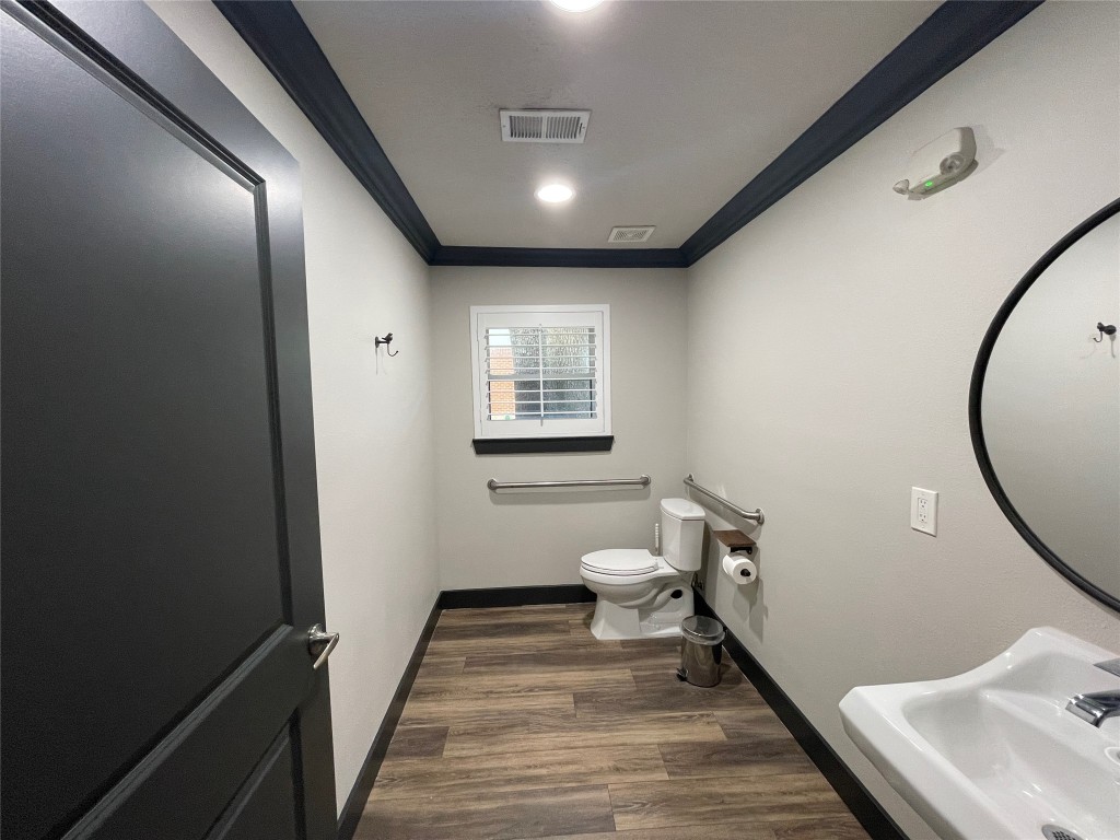 408 Wilson Road Conroe, TX 77301 - Photo 16 of 32 a bathroom with a sink and a mirror