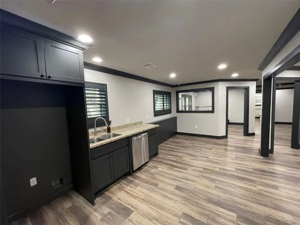 a large kitchen with a large window