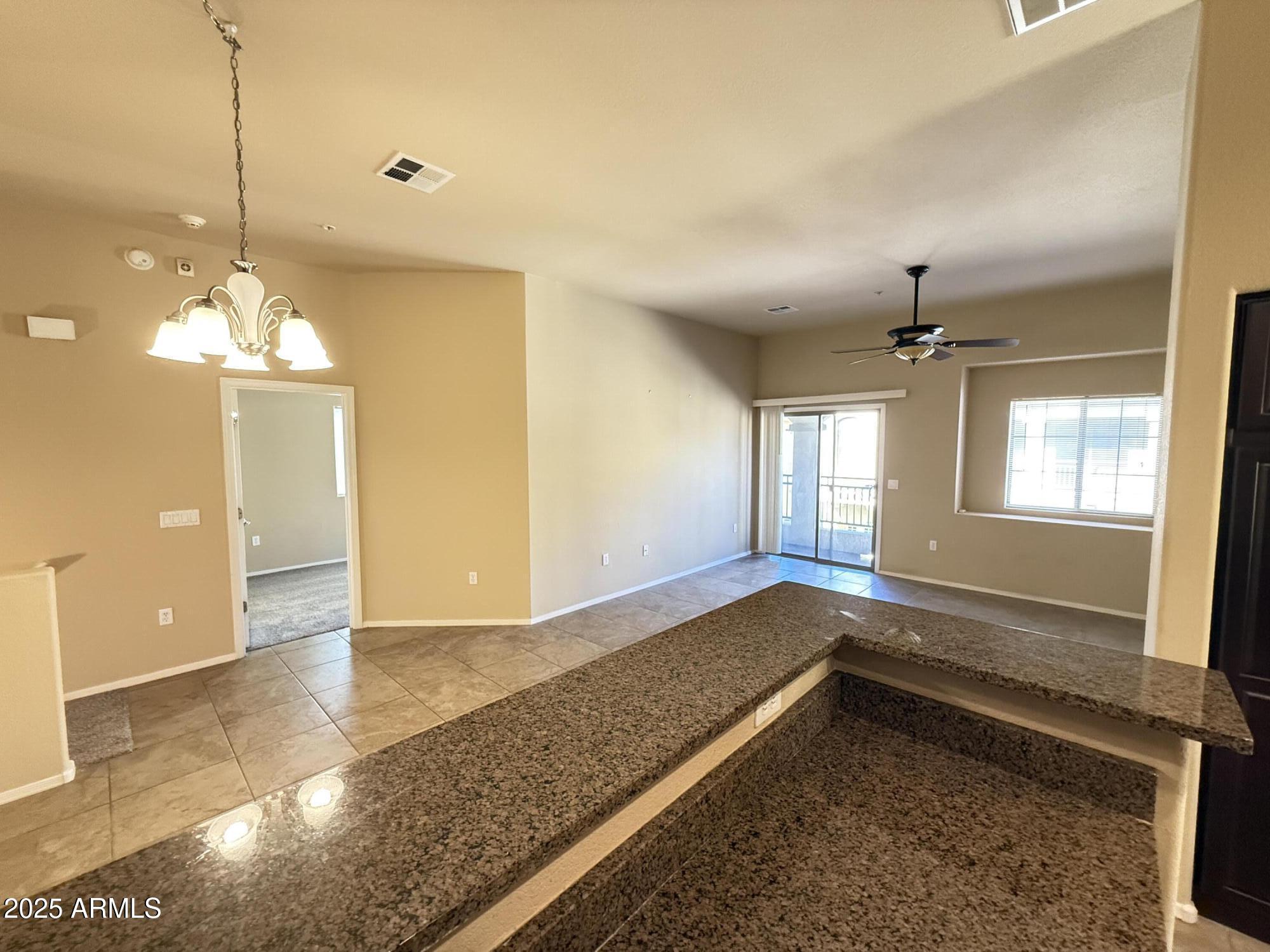 17150 North 23rd Street, Unit 243 Phoenix, AZ 85022 - Photo 11 of 36 a view of a room with a chandelier