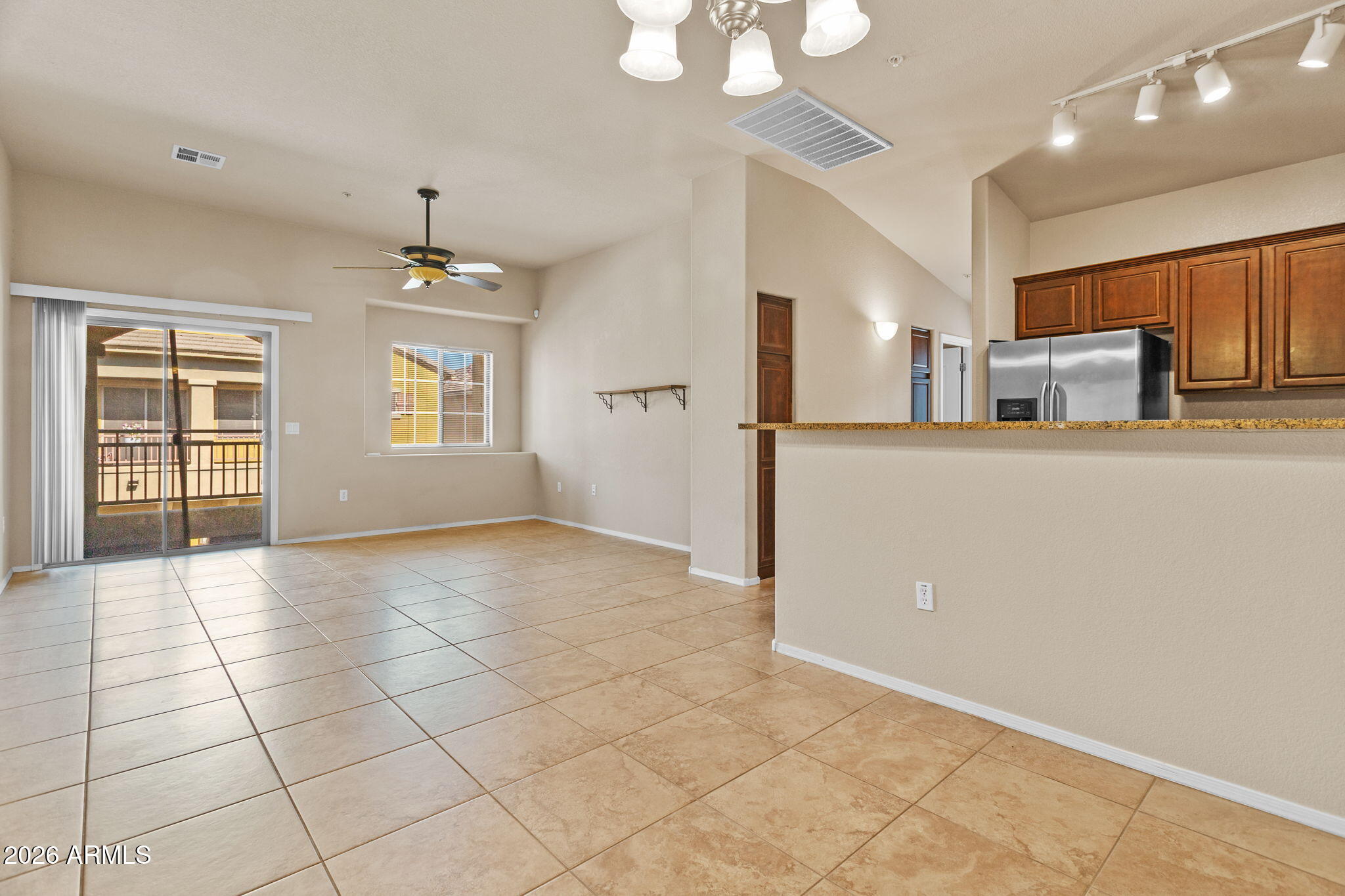 17150 North 23rd Street, Unit 243 Phoenix, AZ 85022 - Photo 12 of 24 a view of a kitchen with furniture and stainless steel appliances