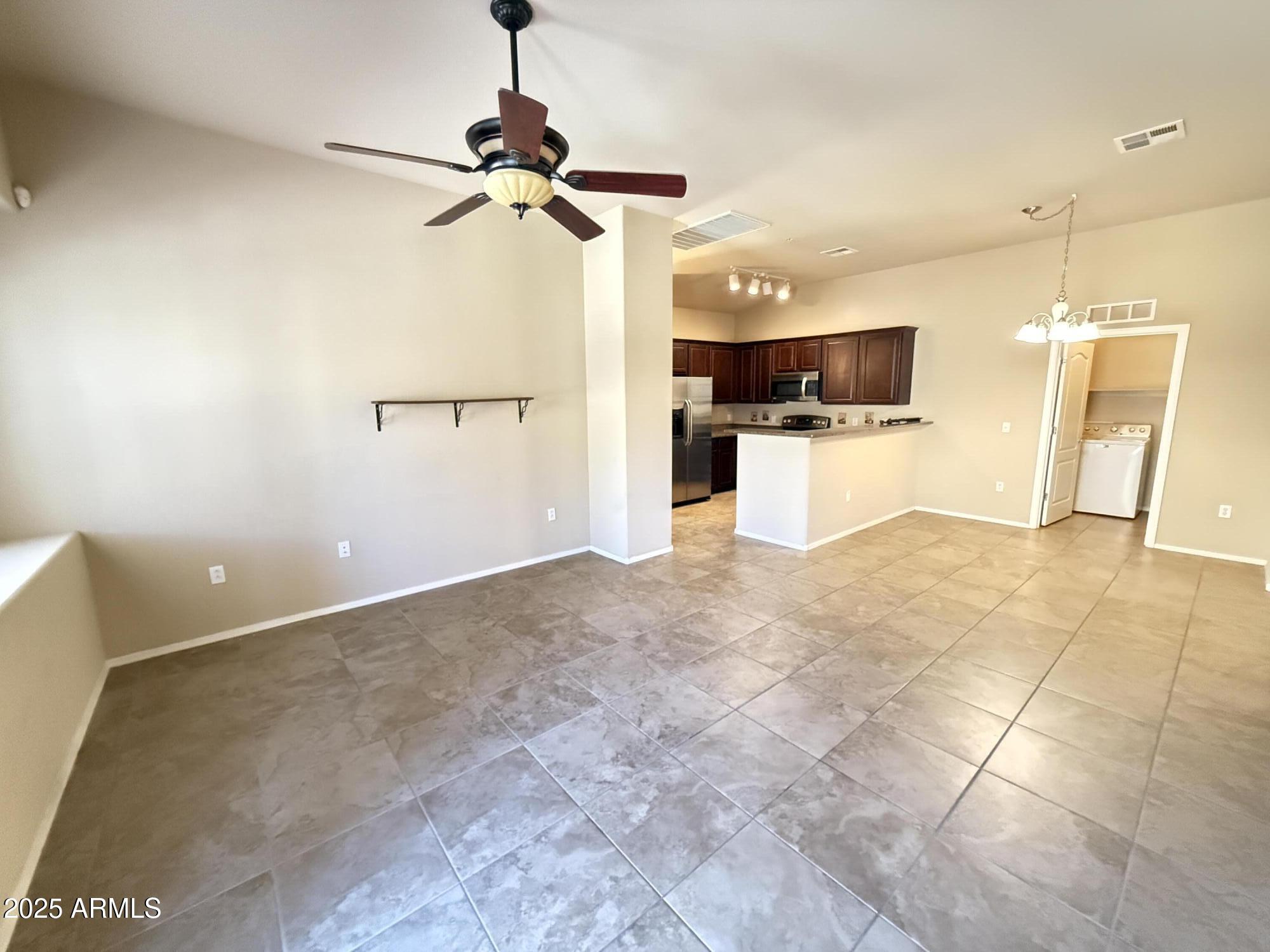 17150 North 23rd Street, Unit 243 Phoenix, AZ 85022 - Photo 14 of 36 a view of a kitchen with a sink and a refrigerator