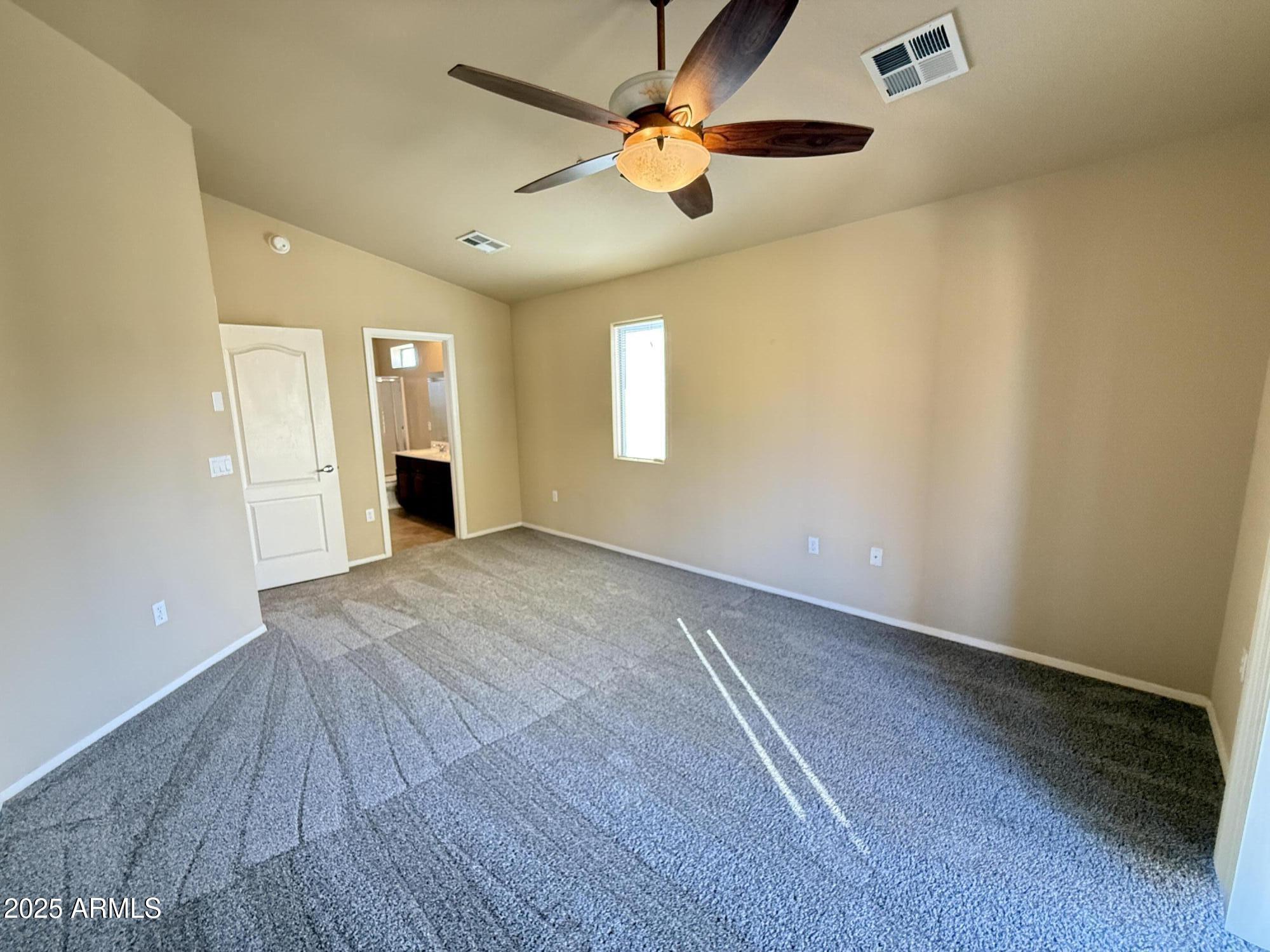 17150 North 23rd Street, Unit 243 Phoenix, AZ 85022 - Photo 18 of 36 wooden floor in an empty room with a window