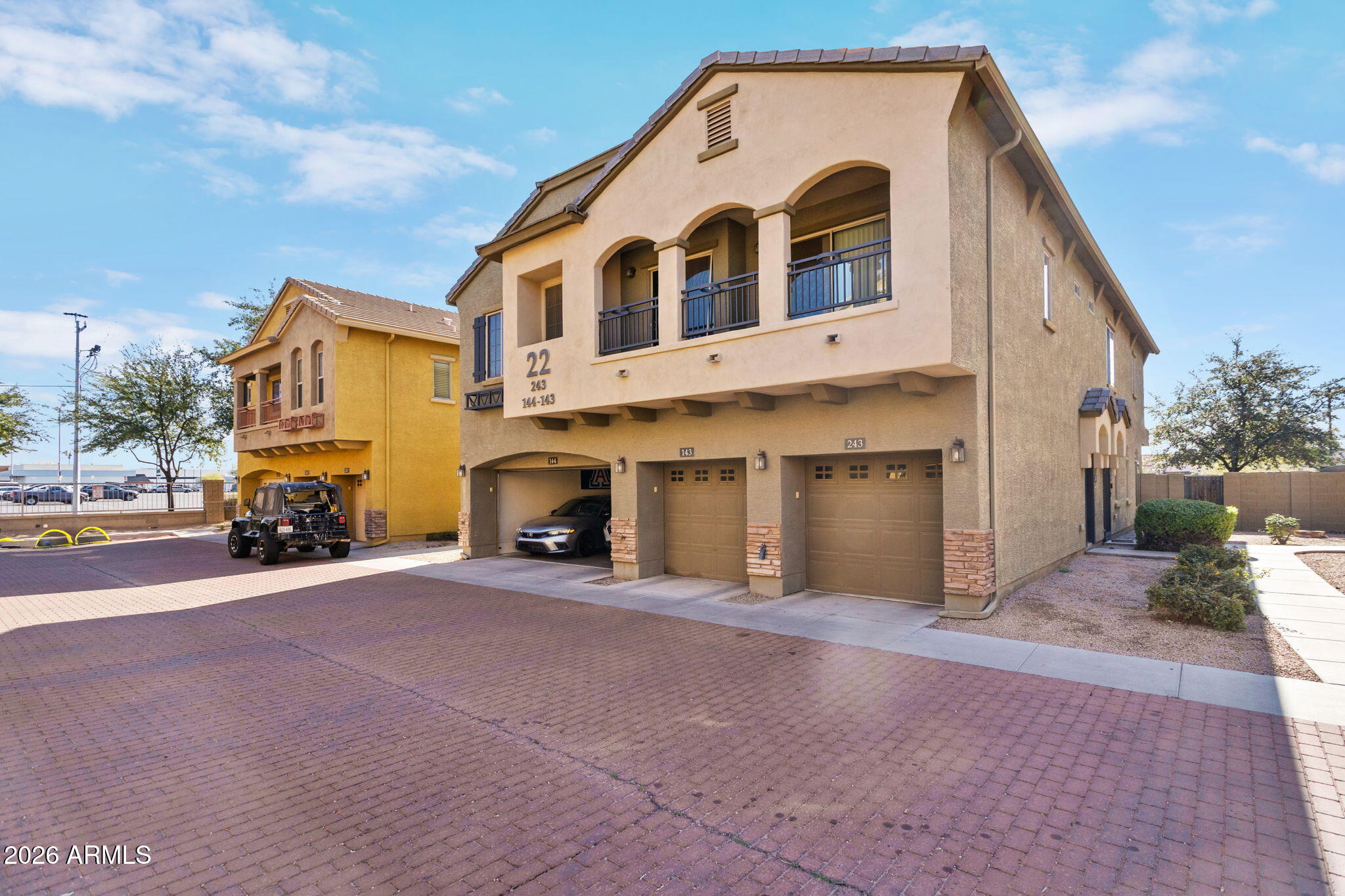 17150 North 23rd Street, Unit 243 Phoenix, AZ 85022 - Photo 2 of 24 a front view of a house with a yard