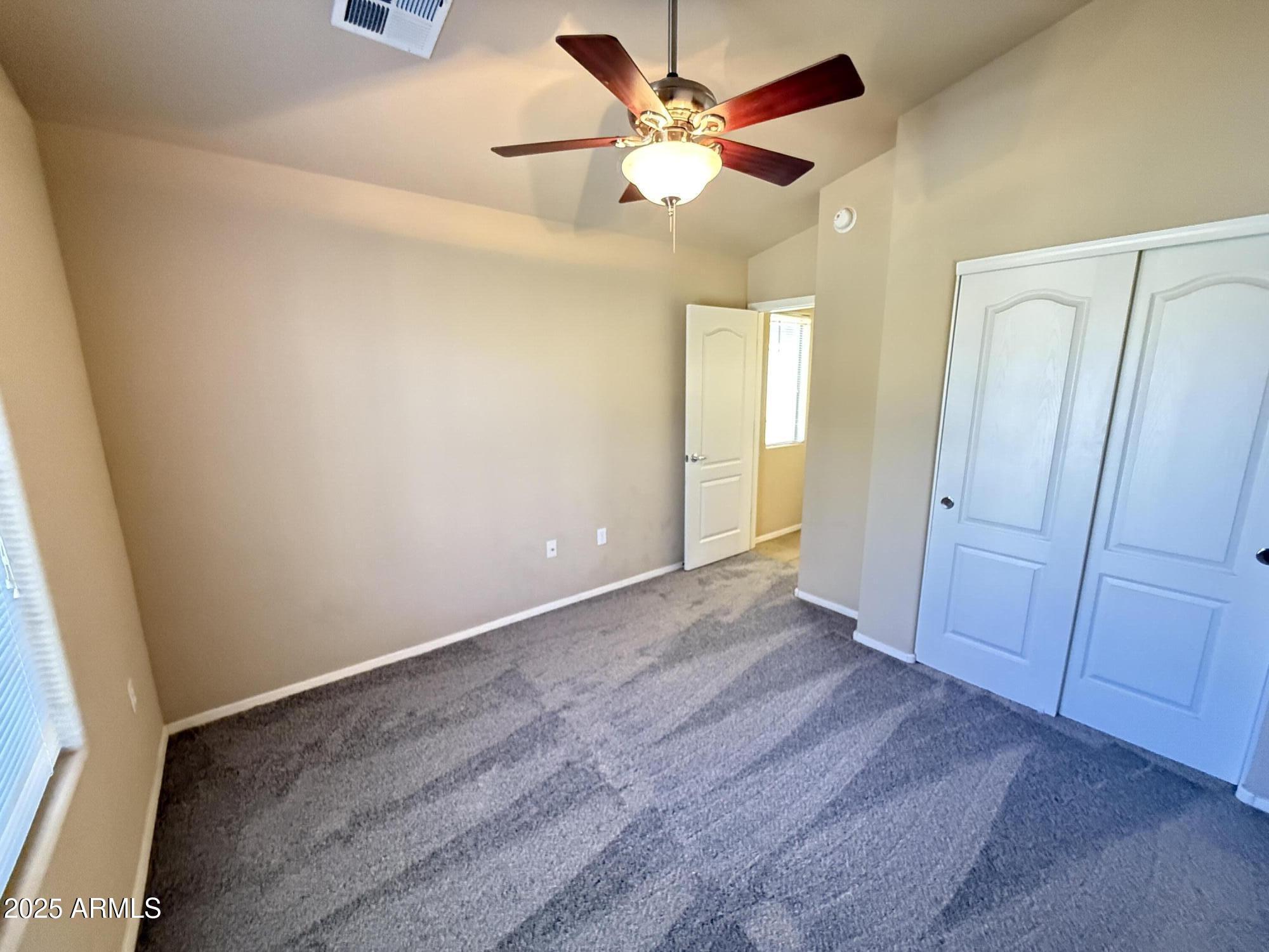 17150 North 23rd Street, Unit 243 Phoenix, AZ 85022 - Photo 23 of 36 wooden floor in an empty room with a window