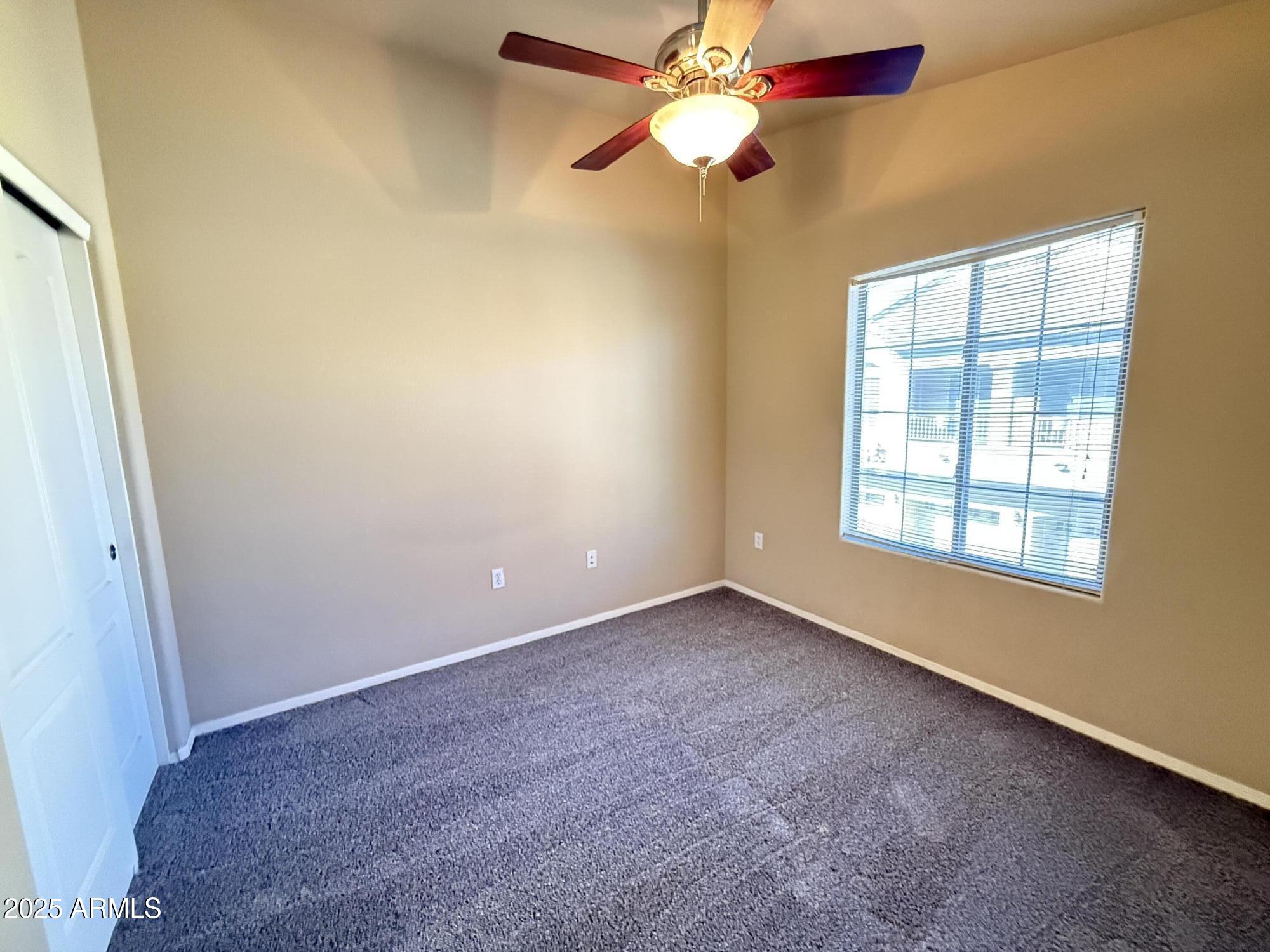 17150 North 23rd Street, Unit 243 Phoenix, AZ 85022 - Photo 27 of 36 an empty room with a window and a fan
