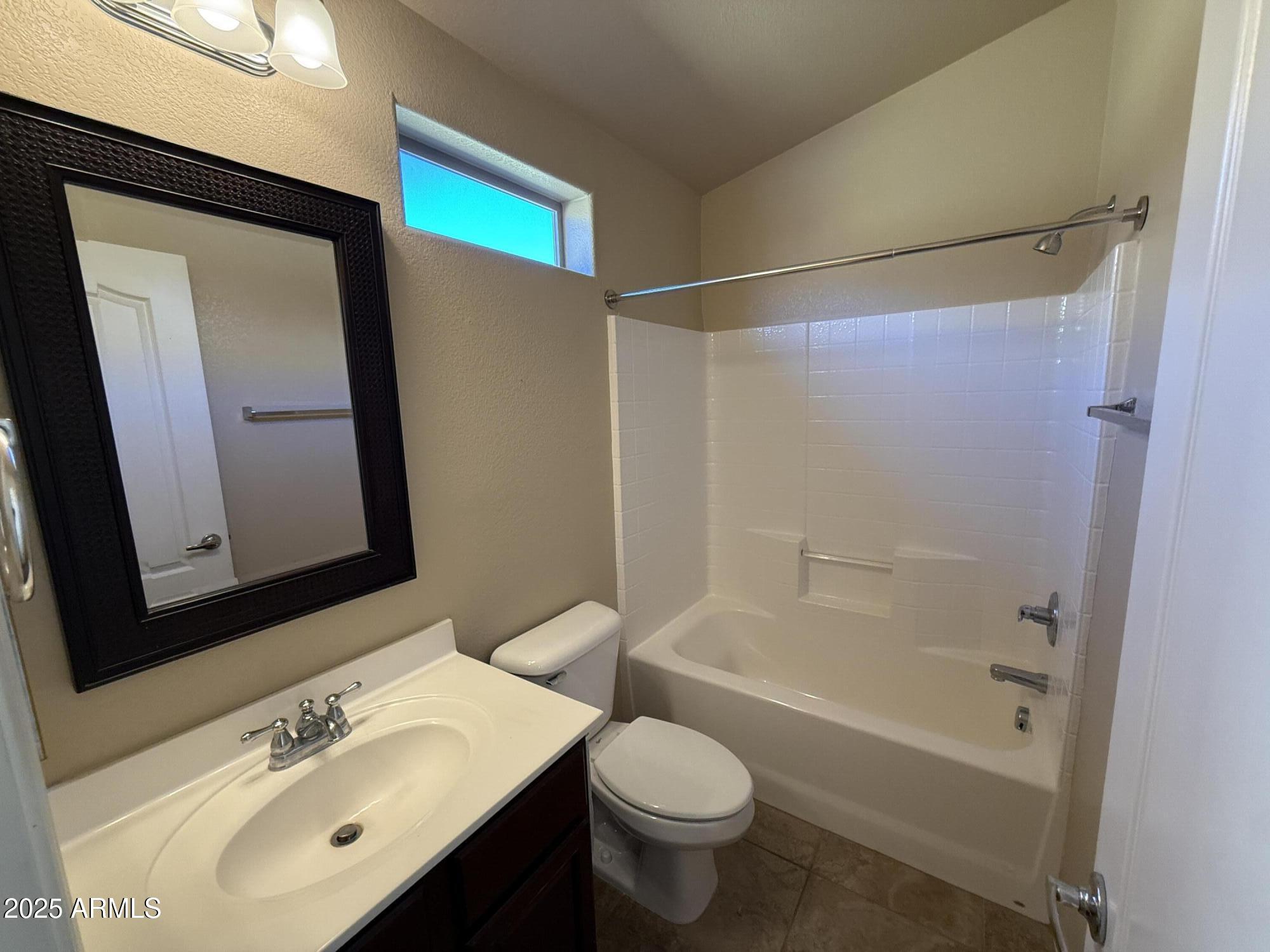 17150 North 23rd Street, Unit 243 Phoenix, AZ 85022 - Photo 28 of 36 a bathroom with a sink mirror toilet and bathtub