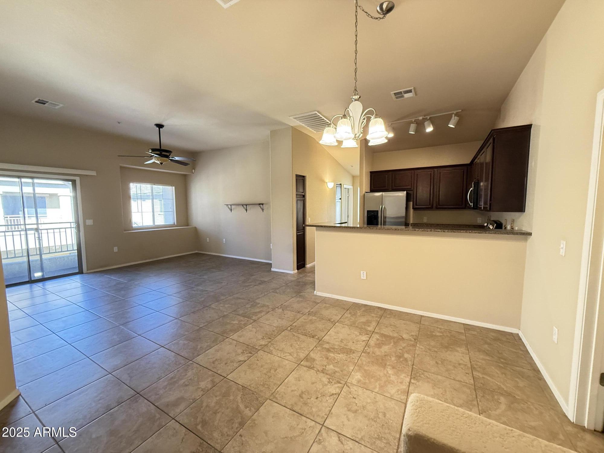 17150 North 23rd Street, Unit 243 Phoenix, AZ 85022 - Photo 3 of 36 a view of a kitchen with a sink and a fireplace