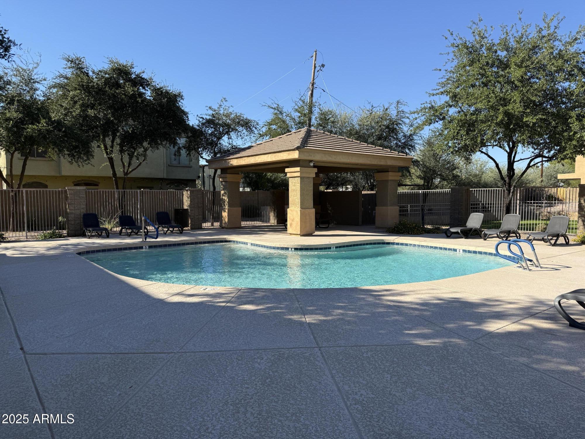 17150 North 23rd Street, Unit 243 Phoenix, AZ 85022 - Photo 34 of 36 a view of a water fountain in front of a house