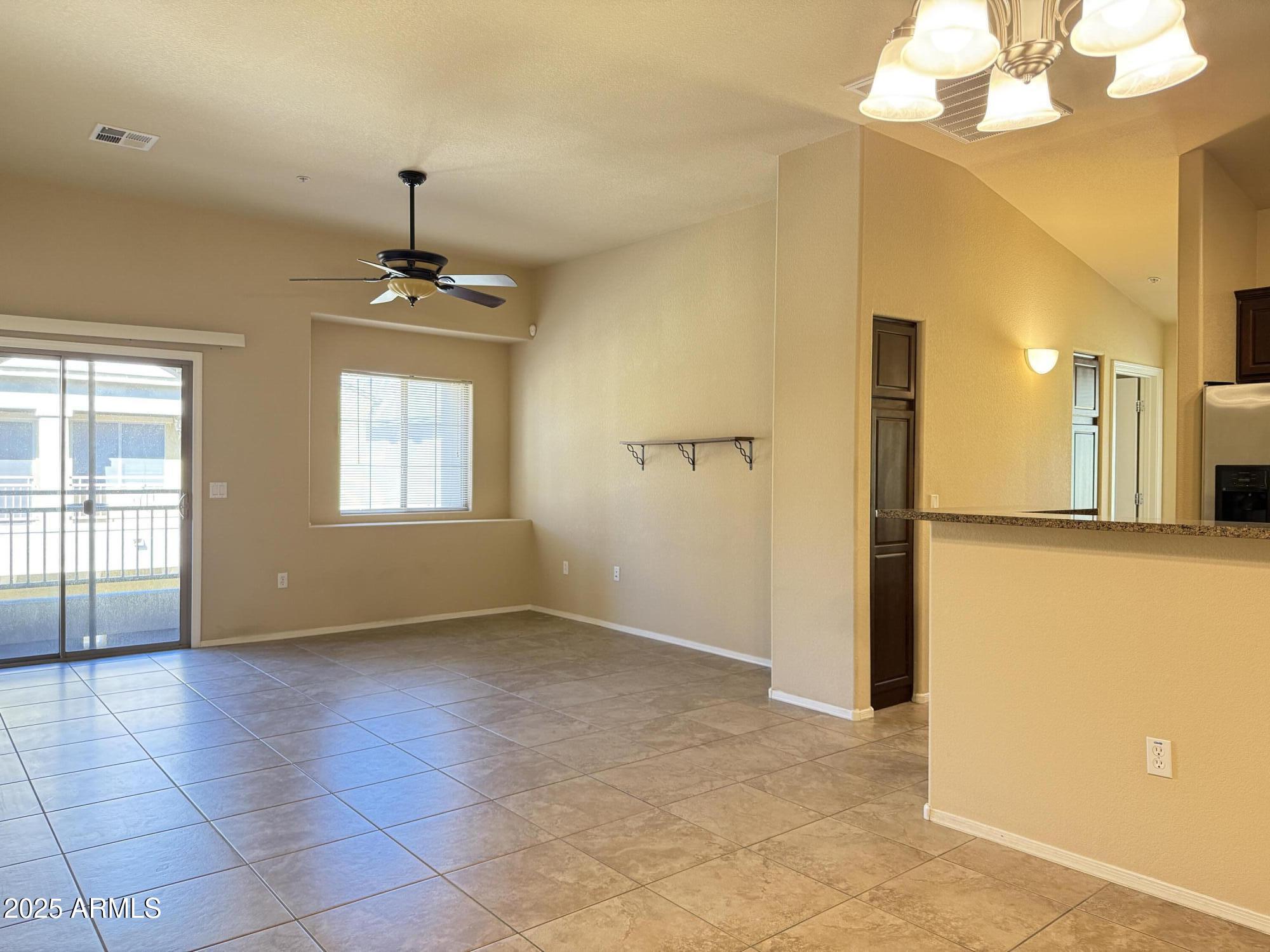 17150 North 23rd Street, Unit 243 Phoenix, AZ 85022 - Photo 4 of 36 a view of an empty room with a window