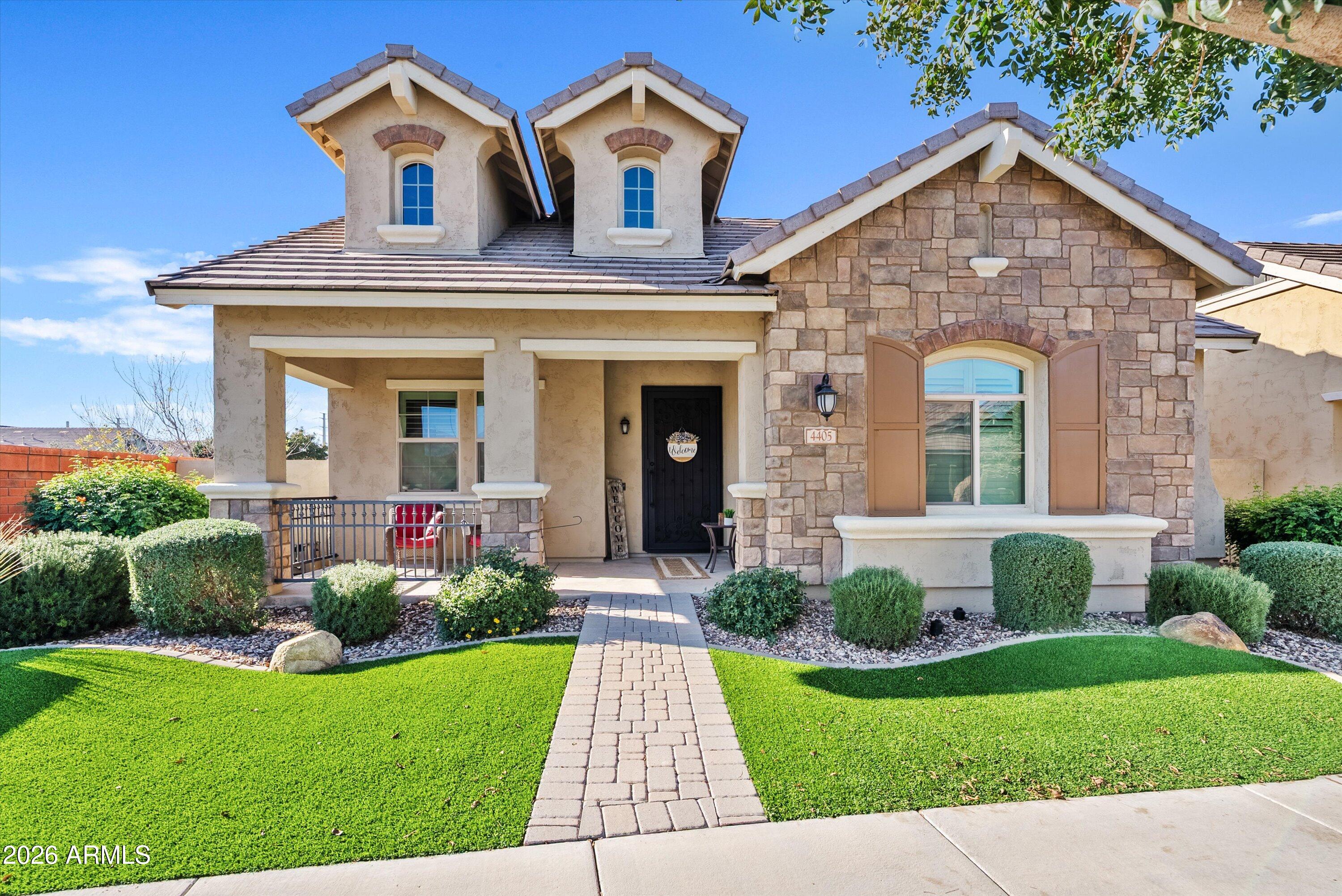 a front view of a house with garden
