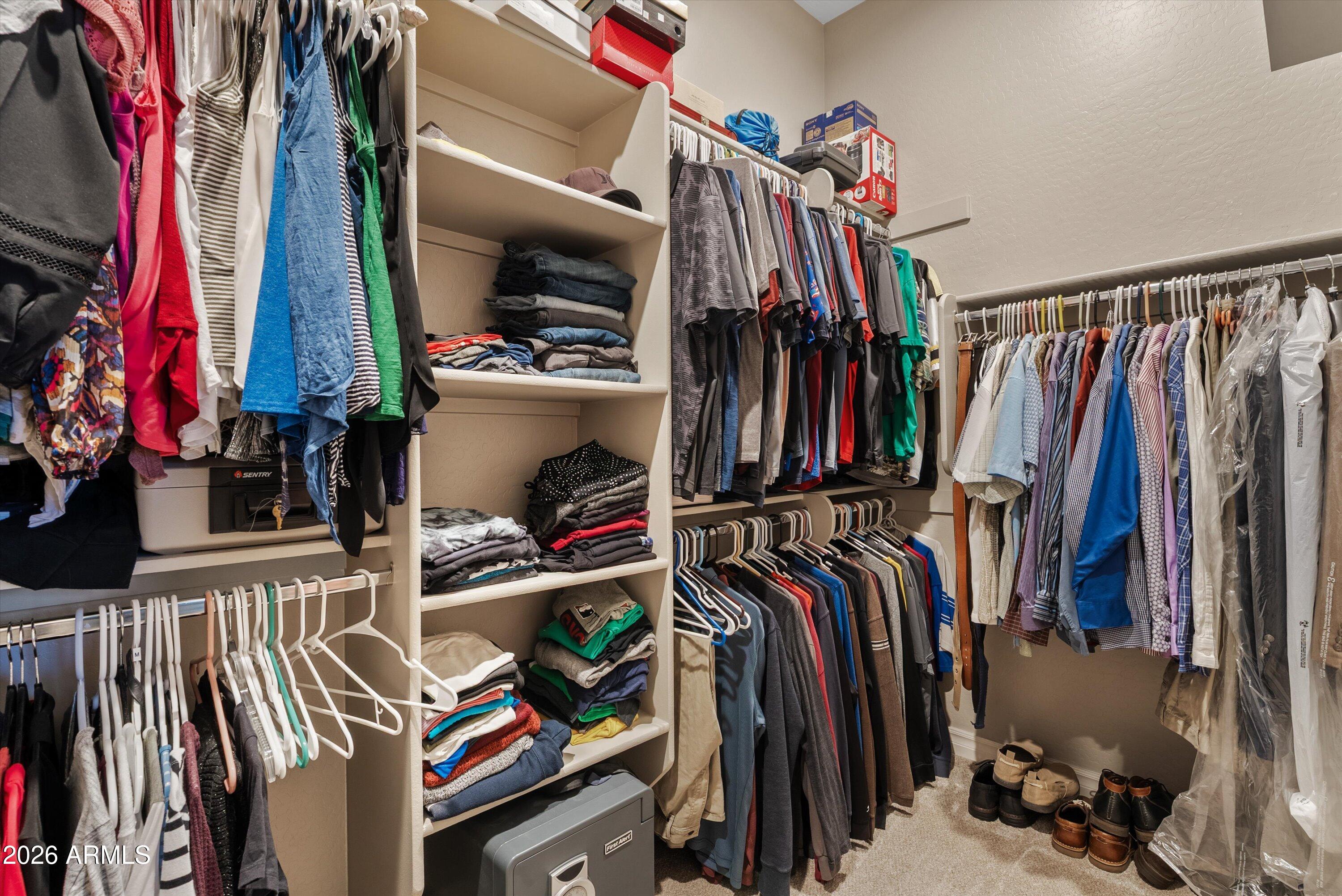 4405 East Dwayne Street Gilbert, AZ 85295 - Photo 12 of 38 a view of walk in closet with clothes