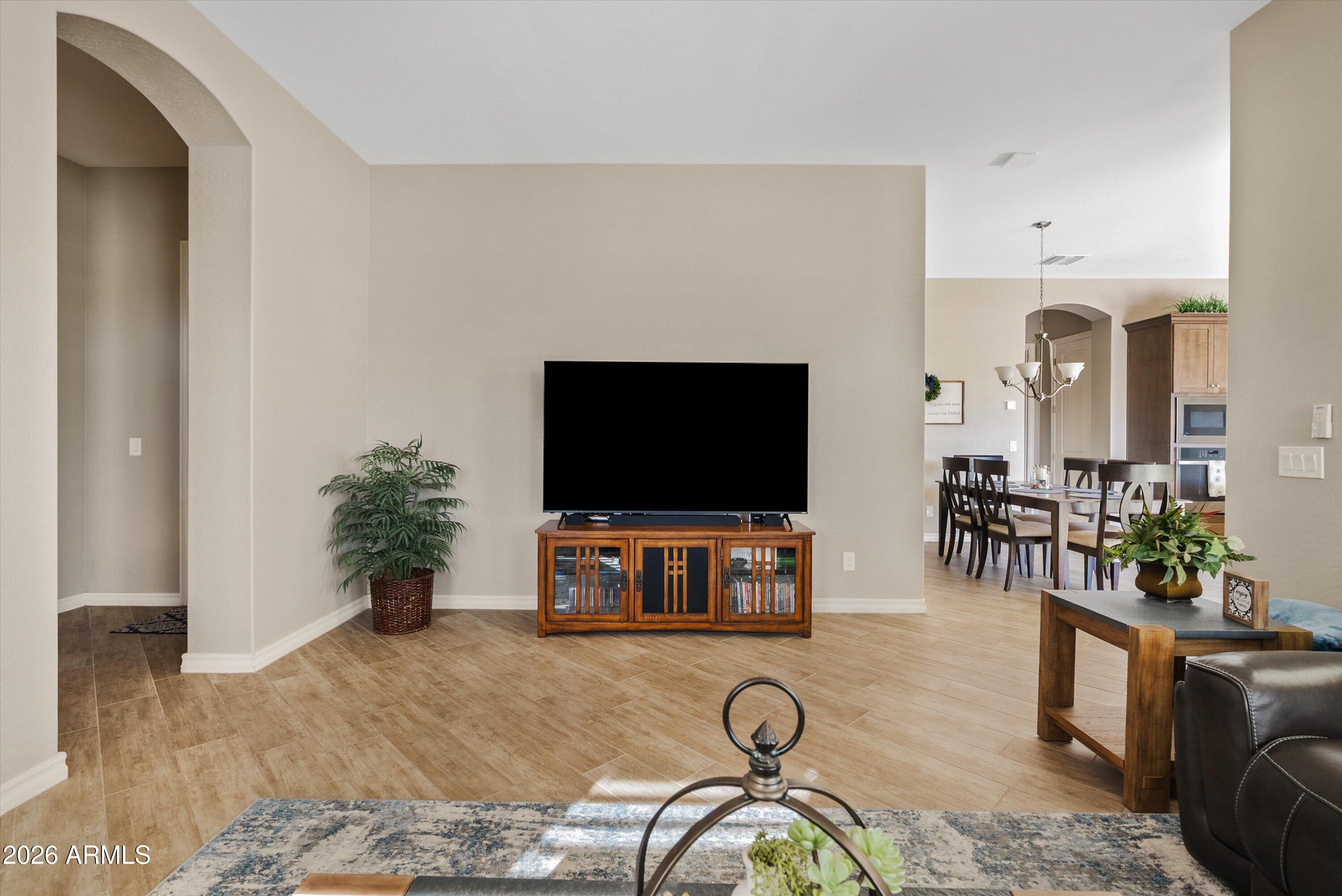 4405 East Dwayne Street Gilbert, AZ 85295 - Photo 23 of 38 a living room with furniture and a flat screen tv