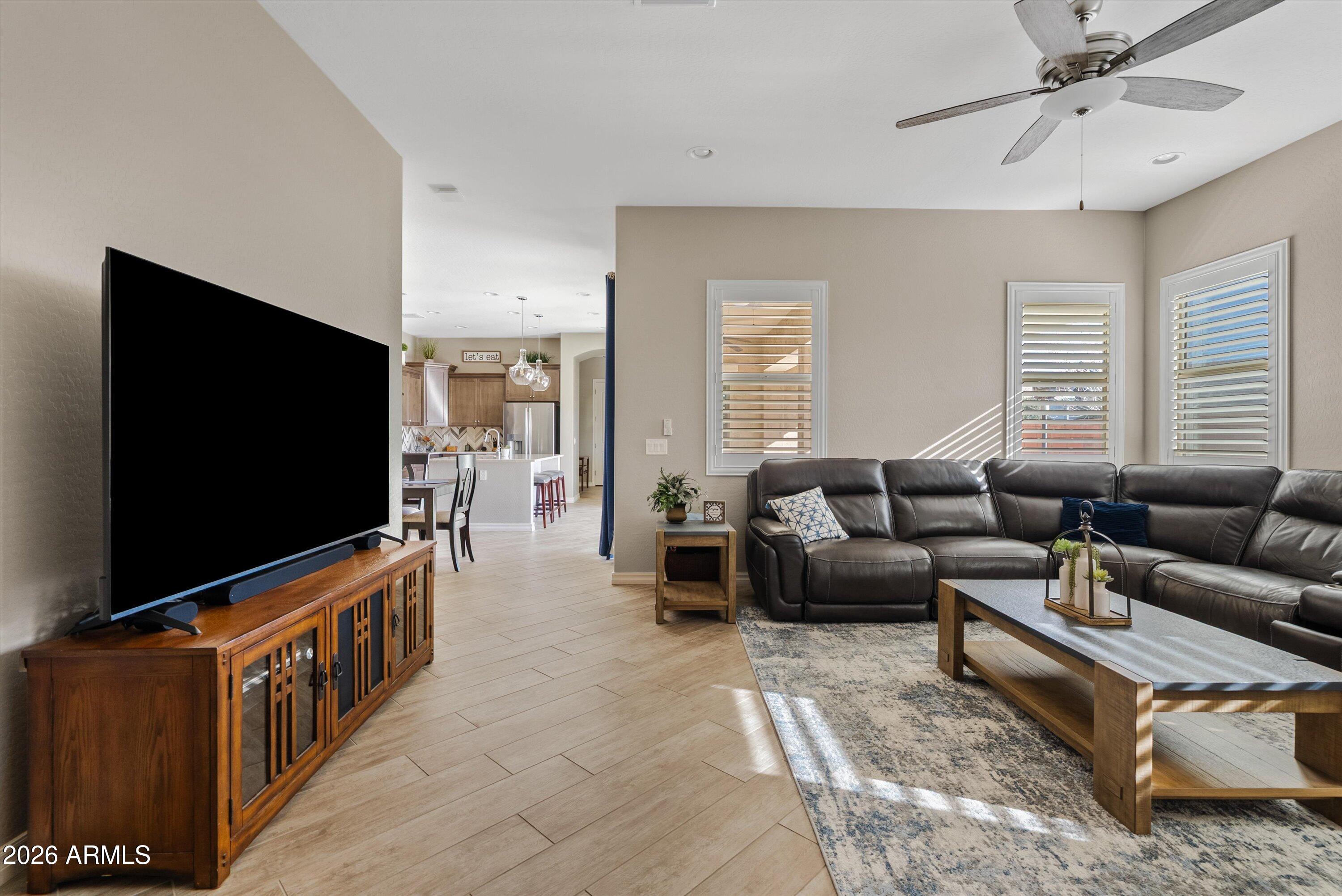 4405 East Dwayne Street Gilbert, AZ 85295 - Photo 24 of 38 a living room with furniture and a flat screen tv