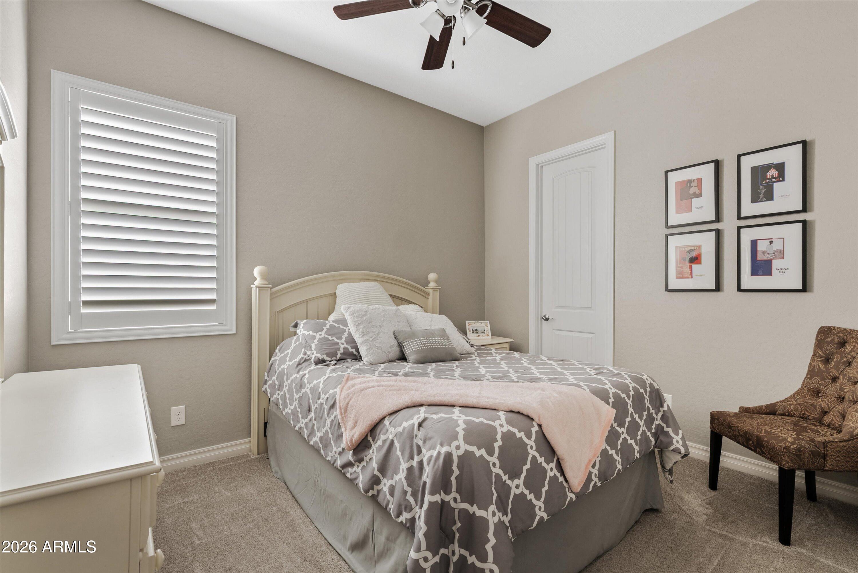 4405 East Dwayne Street Gilbert, AZ 85295 - Photo 26 of 38 a bedroom with a bed and a window