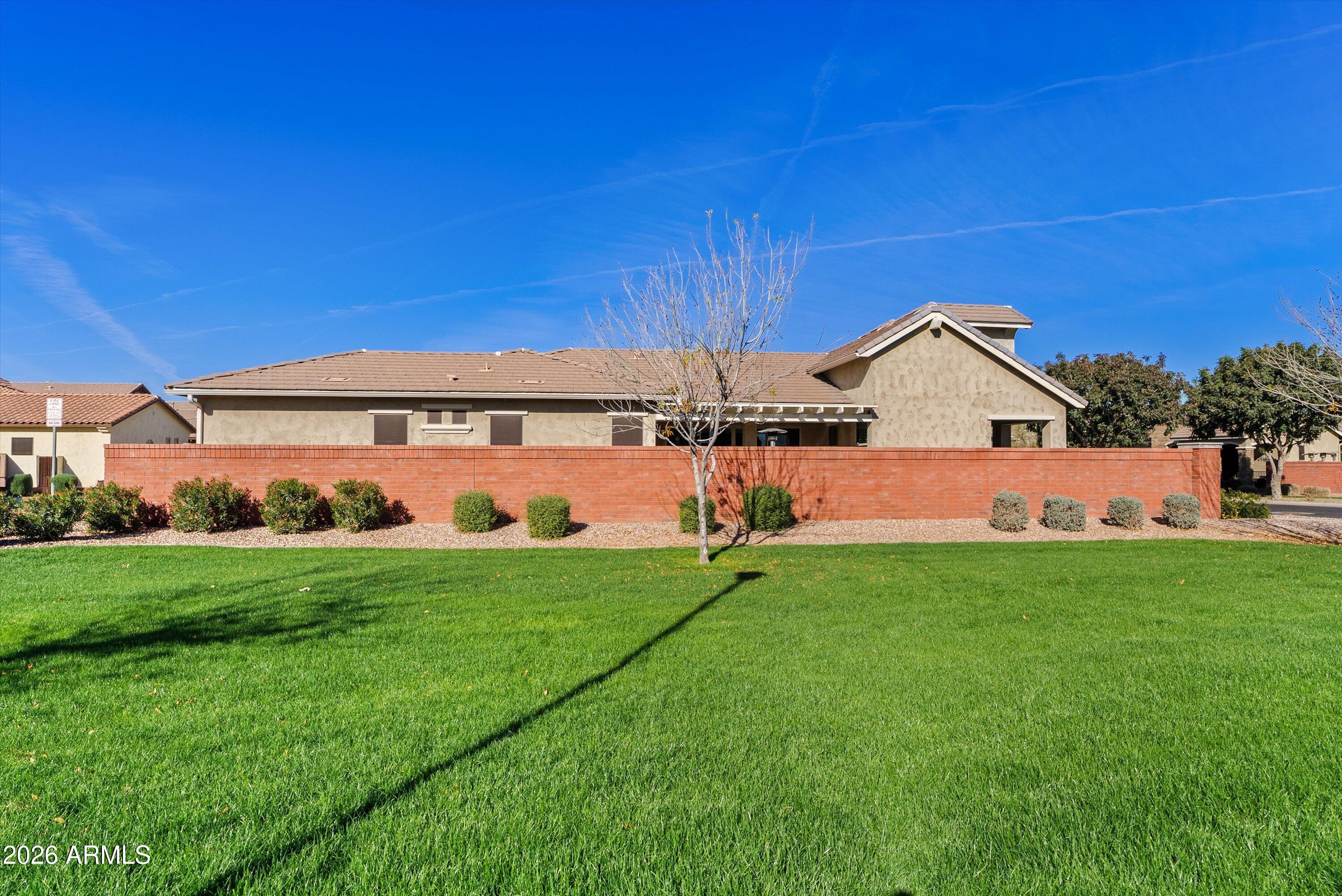 4405 East Dwayne Street Gilbert, AZ 85295 - Photo 35 of 38 a backyard of a house with table and chairs