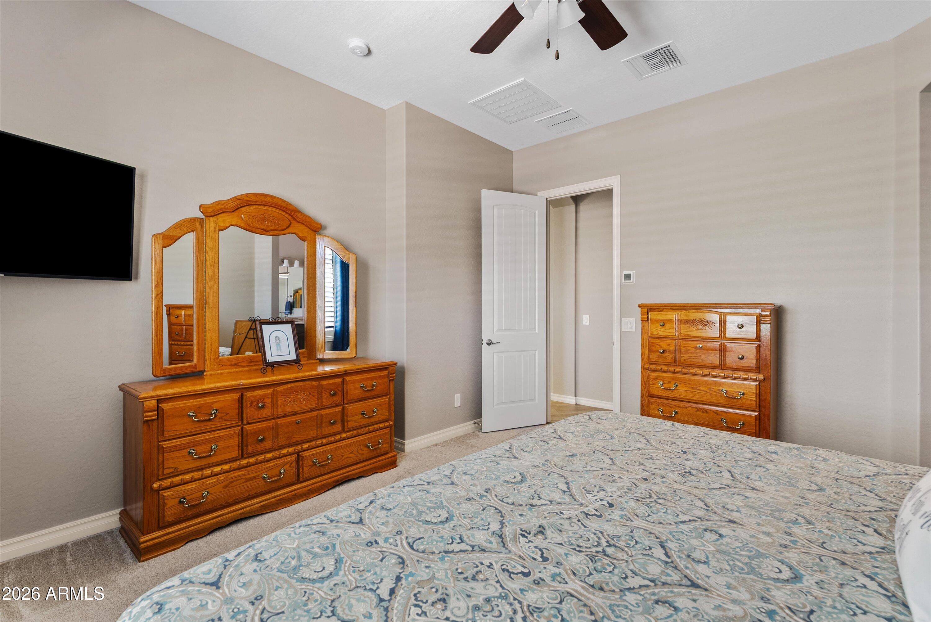 4405 East Dwayne Street Gilbert, AZ 85295 - Photo 7 of 38 a bedroom with a bed and a television