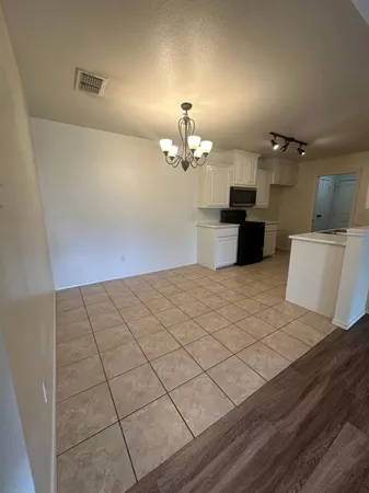 a kitchen with stainless steel appliances a sink a stove a microwave and cabinets