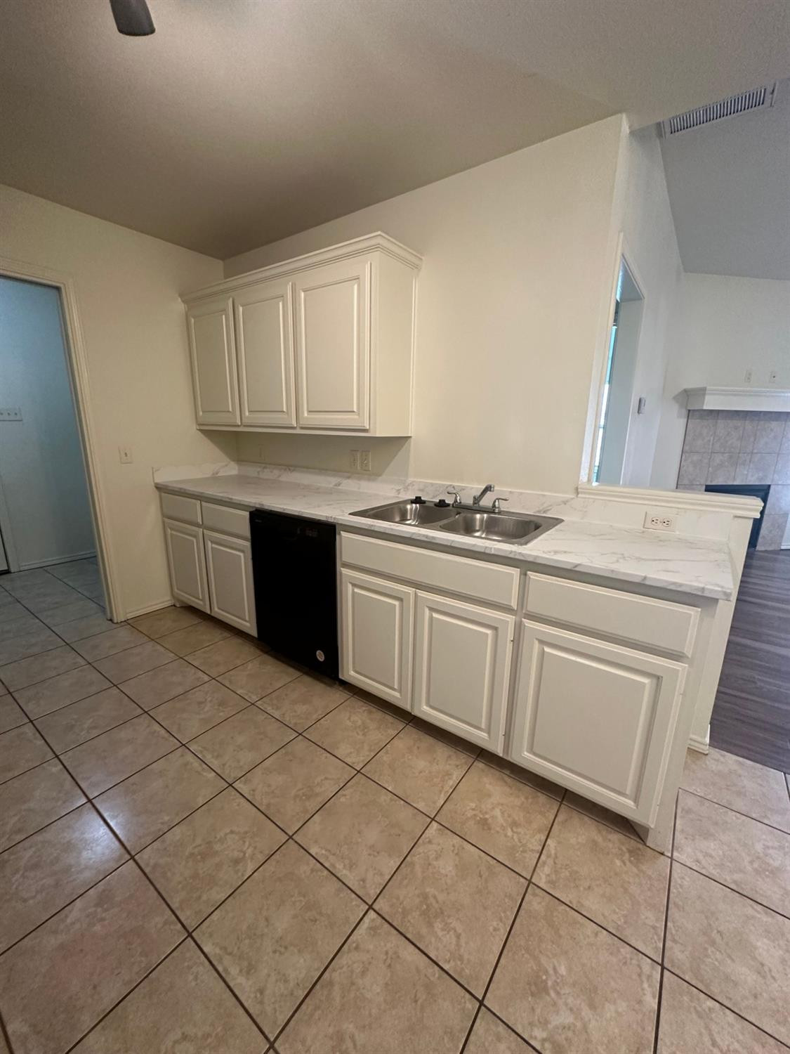 6133 72nd Place, Unit B Lubbock, TX 79424 - Photo 7 of 20 a kitchen with stainless steel appliances granite countertop a sink and a stove