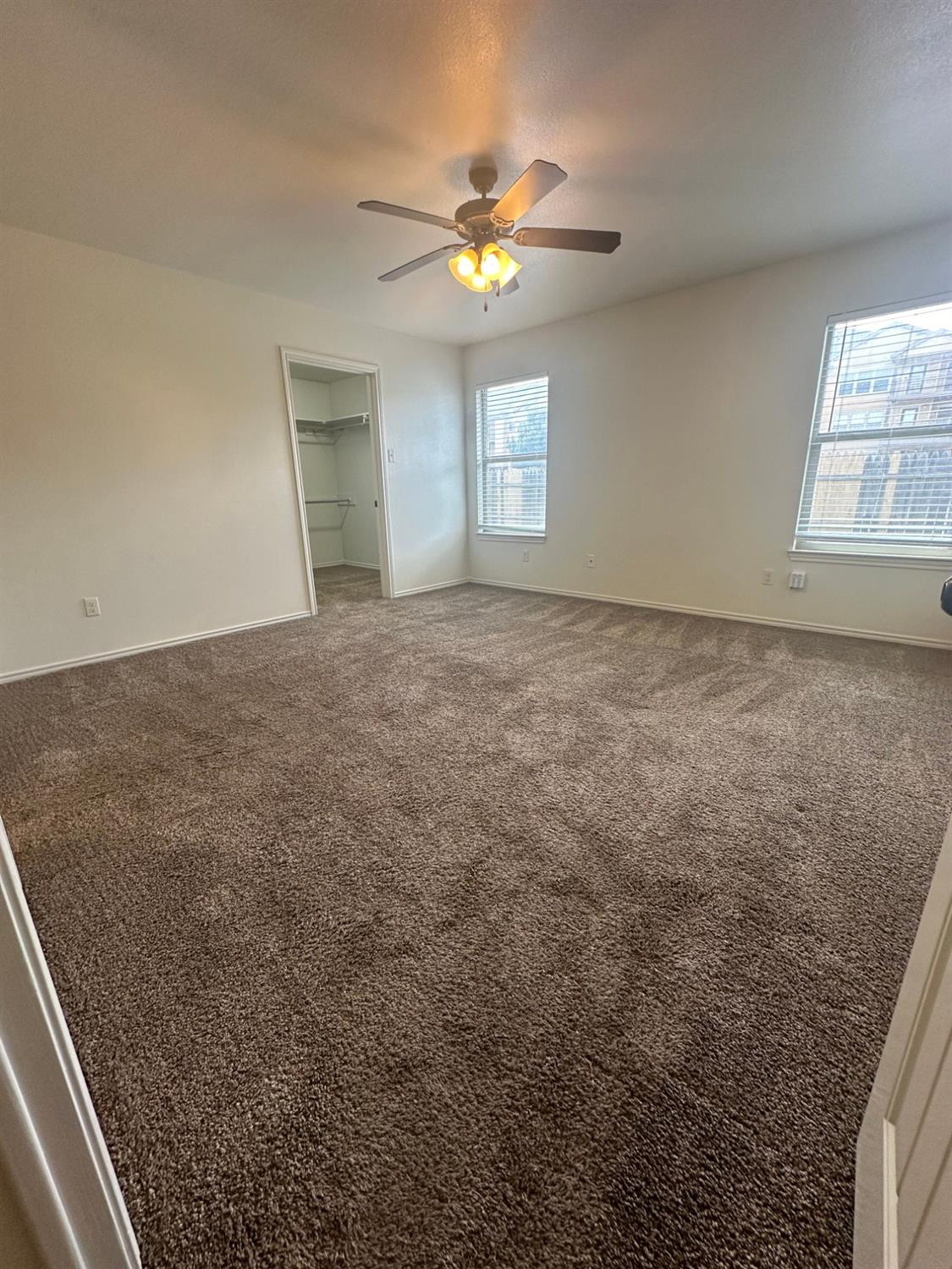6133 72nd Place, Unit B Lubbock, TX 79424 - Photo 9 of 20 a view of an empty room with a window