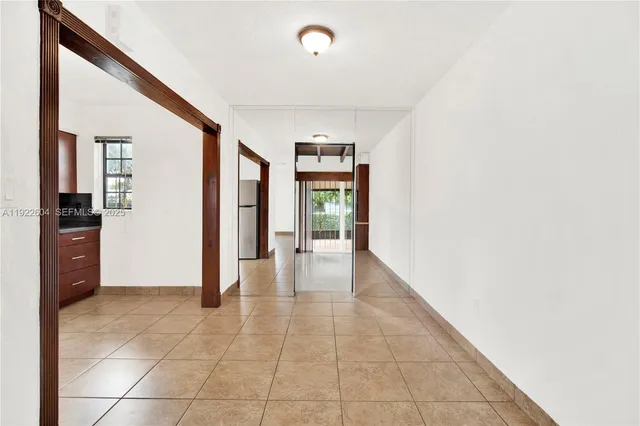 a view of an empty room and window