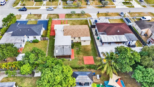 a view of house with a yard