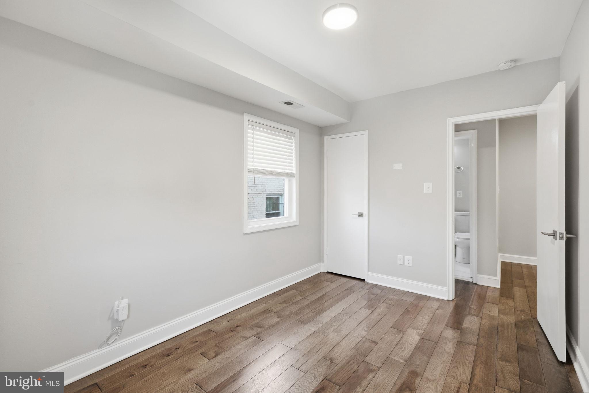 422 Burbank Street Southeast Washington, DC 20019 - Photo 14 of 23 wooden floor in an empty room