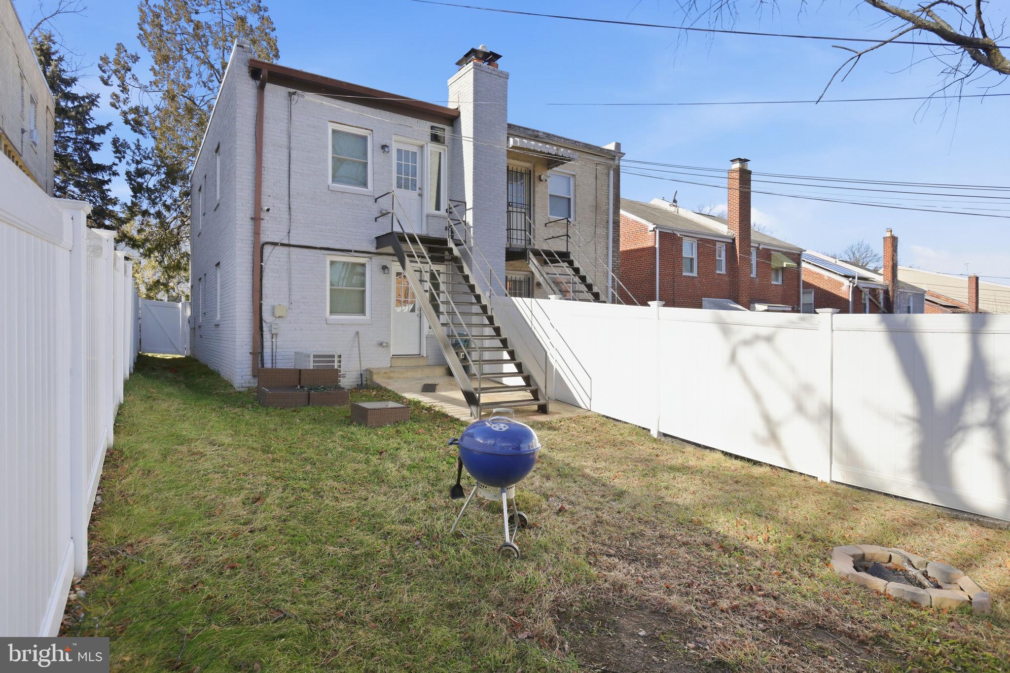 422 Burbank Street Southeast Washington, DC 20019 - Photo 23 of 23 a view of a house with backyard and porch