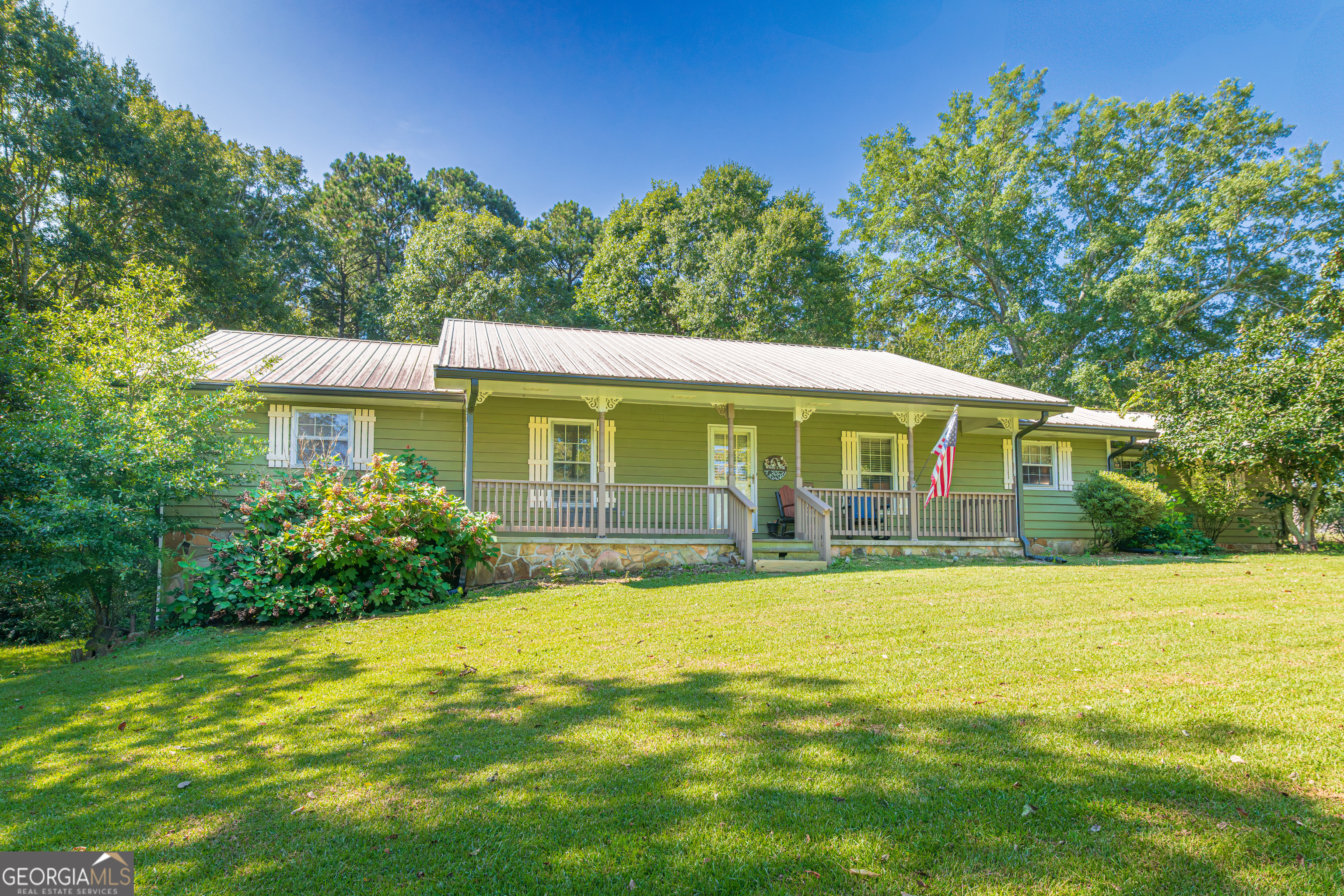 a front view of a house with swimming pool
