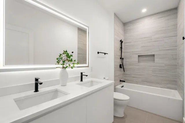 a bathroom with a sink a toilet and a bathtub